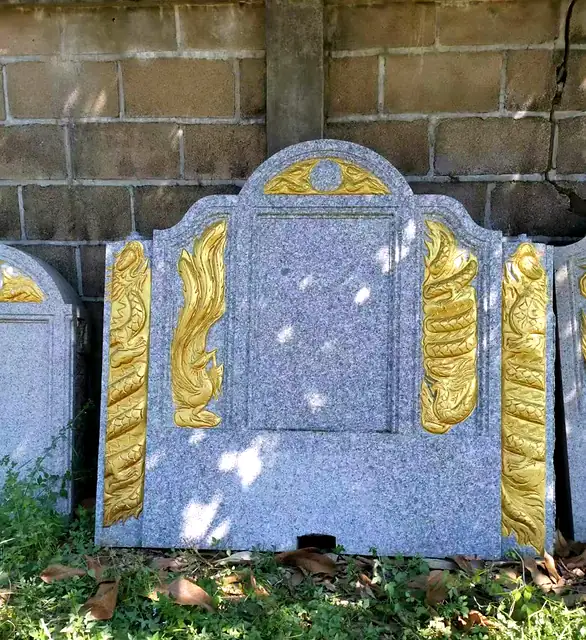 Granite headstone with gold phoenixes