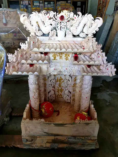 Marble shrine with two-tier roof