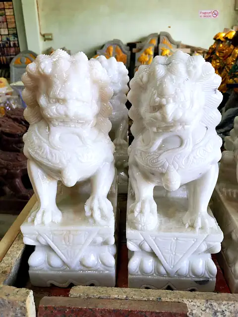Pair of finely carved white marble lions